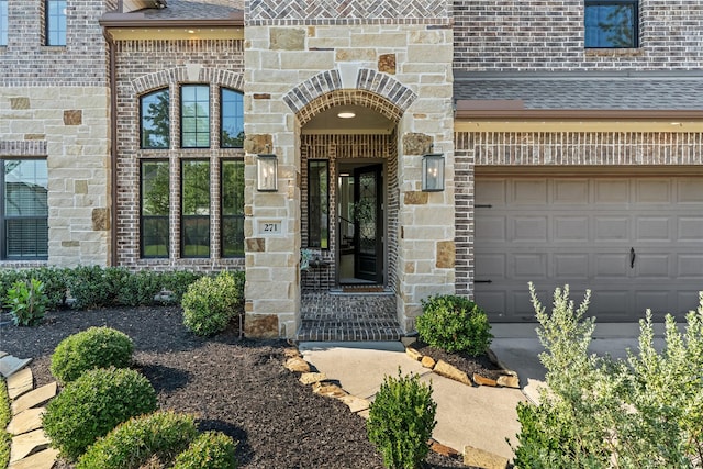 271 Bronze View Dr, Montgomery, TX 77316 - doorway to property with a garage, brick siding, a shingled roof, and stone siding