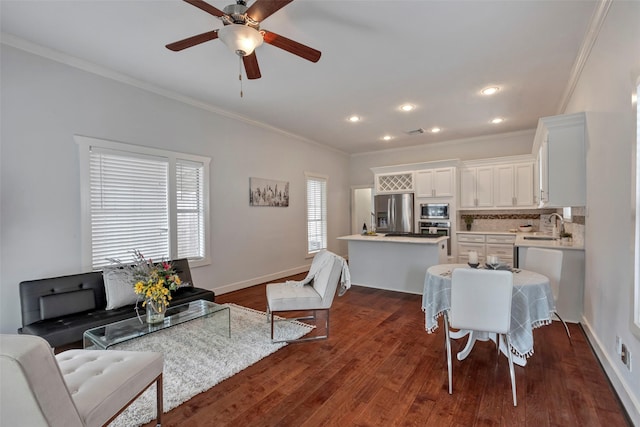 615 Allston St, Houston, TX 77007 - living room with ornamental molding, ceiling fan, dark wood-type flooring, baseboards, and recessed lighting