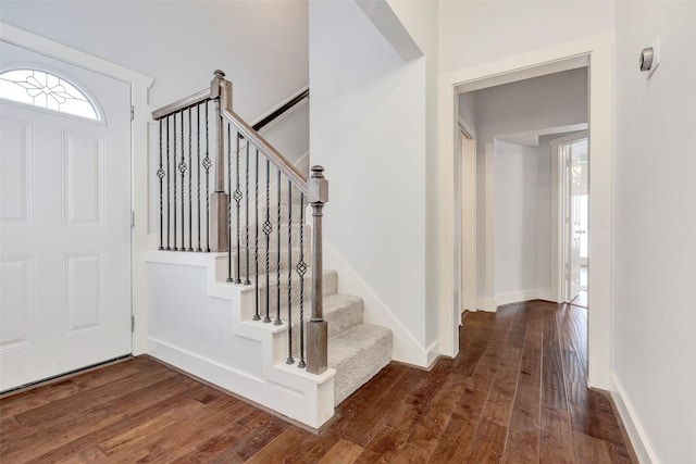 615 Allston St, Houston, TX 77007 - entrance foyer with dark wood-style flooring, stairway, and baseboards