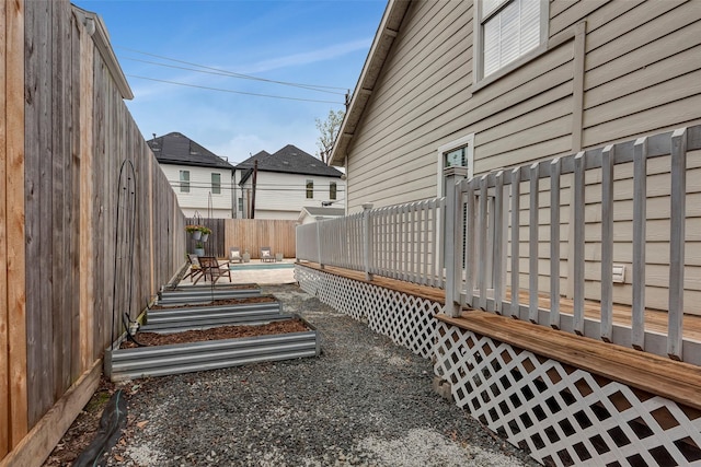 615 Allston St, Houston, TX 77007 - fenced backyard featuring a deck and a garden