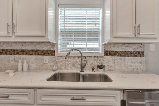 615 Allston St, Houston, TX 77007 - kitchen with a sink, white cabinets, backsplash, and stainless steel dishwasher