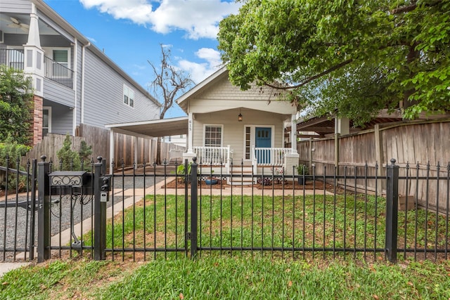 615 Allston St, Houston, TX 77007 - view of front of property with a fenced front yard, an attached carport, covered porch, and a gate
