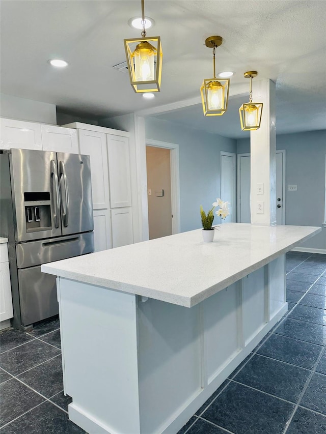 312 Bridal Wreath Ave, Orange, TX 77630 - kitchen with stainless steel fridge with ice dispenser, white cabinets, hanging light fixtures, light stone countertops, and recessed lighting