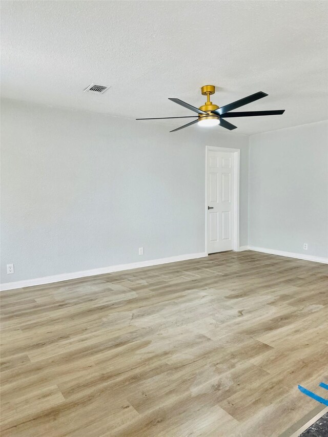 312 Bridal Wreath Ave, Orange, TX 77630 - unfurnished room with light wood-type flooring, baseboards, and a ceiling fan