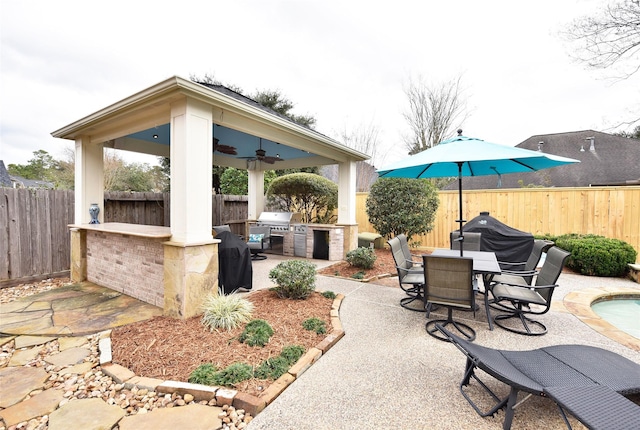 6002 Shady Birch Holw, Kingwood, TX 77345 - fenced backyard featuring a patio area, ceiling fan, outdoor dining space, and a gazebo
