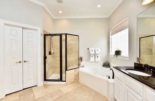 6002 Shady Birch Holw, Kingwood, TX 77345 - bathroom with a tub with jets, a shower stall, vanity, crown molding, and recessed lighting