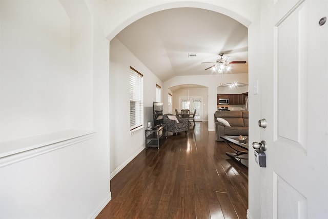 9609 Landon Lake Dr, Pearland, TX 77584 - foyer with arched walkways, a ceiling fan, hardwood / wood-style flooring, baseboards, and lofted ceiling