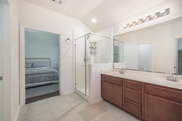 9609 Landon Lake Dr, Pearland, TX 77584 - ensuite bathroom featuring a stall shower, double vanity, tile patterned floors, and vaulted ceiling