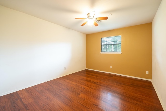 7613 Parker Rd, Houston, TX 77016 - empty room with a ceiling fan, wood finished floors, and baseboards