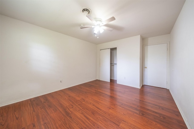 7613 Parker Rd, Houston, TX 77016 - unfurnished bedroom with wood finished floors, a closet, a ceiling fan, and baseboards
