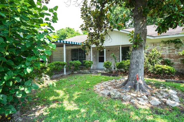 7613 Parker Rd, Houston, TX 77016 - ranch-style house with brick siding, a garage, and a shingled roof