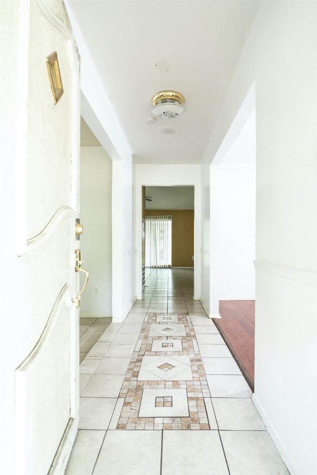 7613 Parker Rd, Houston, TX 77016 - hall featuring light tile patterned floors and baseboards