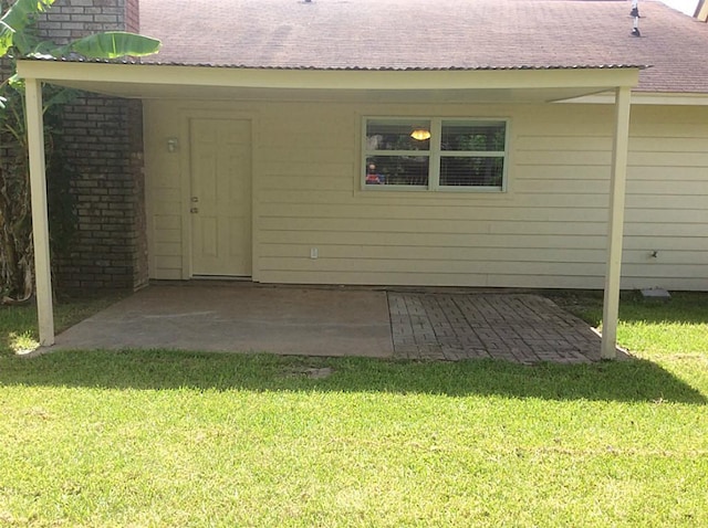 5 Lazybrook St, Angleton, TX 77515 - rear view of property featuring a yard, a patio, and a shingled roof