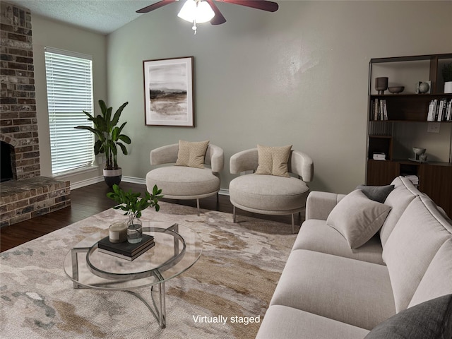 5 Lazybrook St, Angleton, TX 77515 - living area featuring a ceiling fan, wood finished floors, baseboards, a textured ceiling, and lofted ceiling
