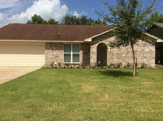 5 Lazybrook St, Angleton, TX 77515 - ranch-style home featuring concrete driveway, an attached garage, a front yard, and brick siding