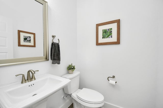 18511 Adventurous Way, Cypress, TX 77433 - bathroom featuring a sink, toilet, and baseboards