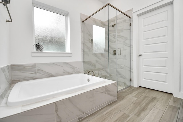 18511 Adventurous Way, Cypress, TX 77433 - full bathroom with a marble finish shower, a bath, and wood finished floors