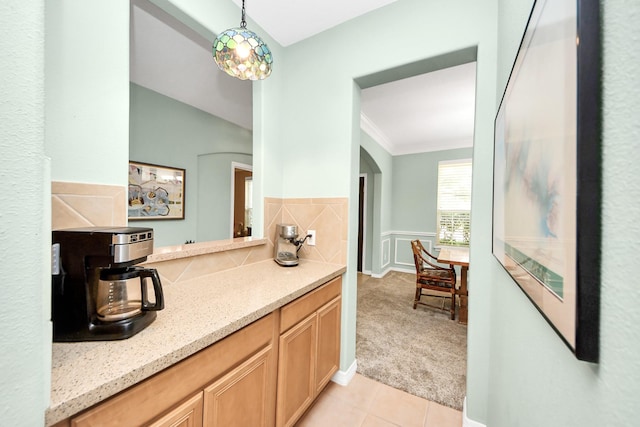 11401 Starlight Bay St, Pearland, TX 77584 - bathroom with tile patterned floors, crown molding, a wainscoted wall, and vanity