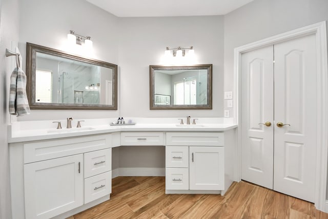 11401 Starlight Bay St, Pearland, TX 77584 - full bath with wood finished floors, double vanity, and a shower