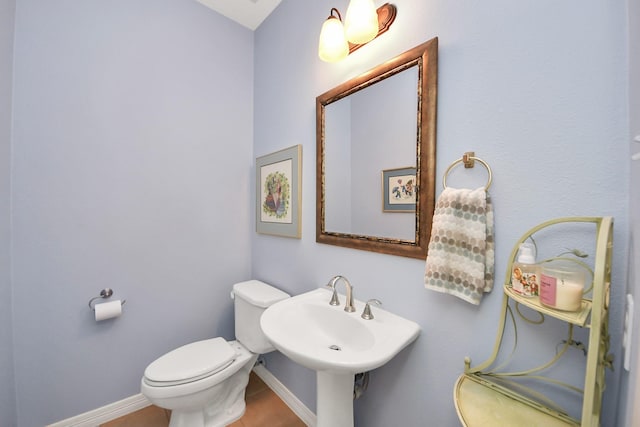 11401 Starlight Bay St, Pearland, TX 77584 - bathroom with toilet, baseboards, and a sink