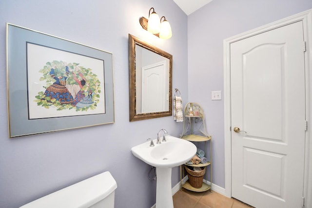 11401 Starlight Bay St, Pearland, TX 77584 - half bathroom featuring tile patterned flooring, toilet, and baseboards