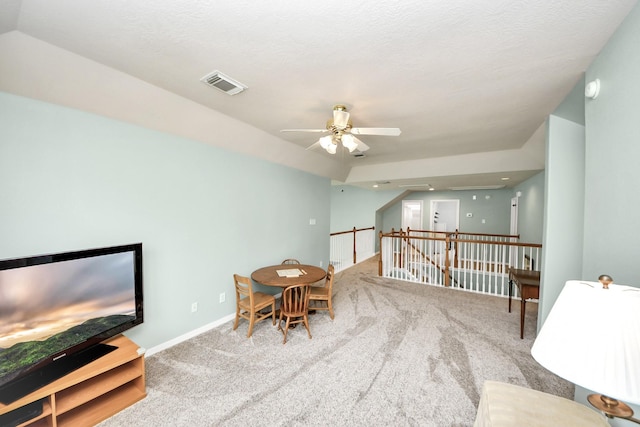 11401 Starlight Bay St, Pearland, TX 77584 - living area with carpet flooring, a ceiling fan, an upstairs landing, and baseboards
