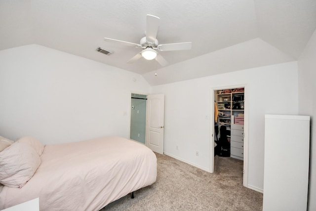 11401 Starlight Bay St, Pearland, TX 77584 - bedroom featuring vaulted ceiling, a walk in closet, light carpet, a closet, and ceiling fan