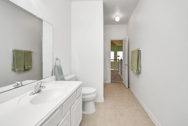 11401 Starlight Bay St, Pearland, TX 77584 - bathroom featuring toilet, tile patterned flooring, vanity, and baseboards
