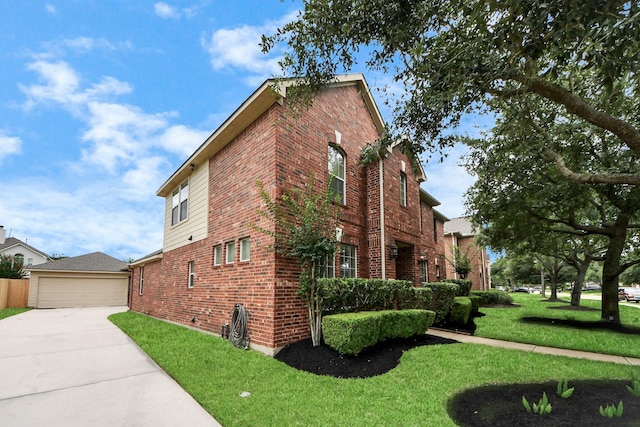 11401 Starlight Bay St, Pearland, TX 77584 - view of property exterior with brick siding, a lawn, and concrete driveway