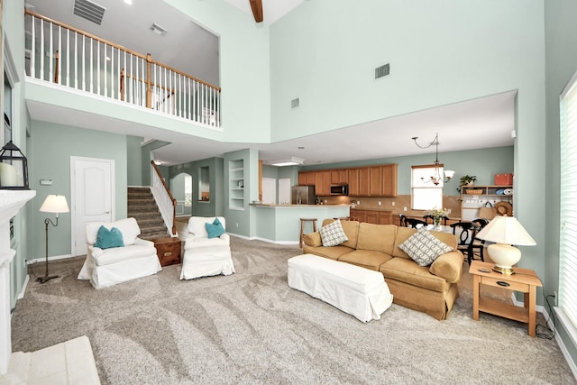 11401 Starlight Bay St, Pearland, TX 77584 - living room featuring a towering ceiling, light colored carpet, stairway, a fireplace, and baseboards