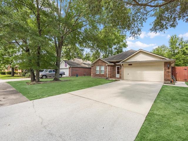 27097 Crown Chase Dr, Kingwood, TX 77339 - single story home with an attached garage, concrete driveway, and brick siding