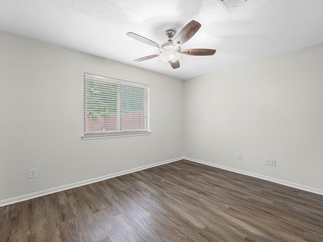 27097 Crown Chase Dr, Kingwood, TX 77339 - empty room featuring dark wood-style flooring, ceiling fan, and baseboards