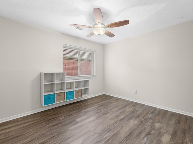 27097 Crown Chase Dr, Kingwood, TX 77339 - unfurnished room with wood finished floors, ceiling fan, and baseboards