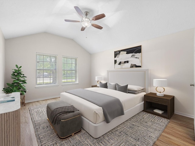 27097 Crown Chase Dr, Kingwood, TX 77339 - bedroom with wood finished floors, baseboards, lofted ceiling, and ceiling fan