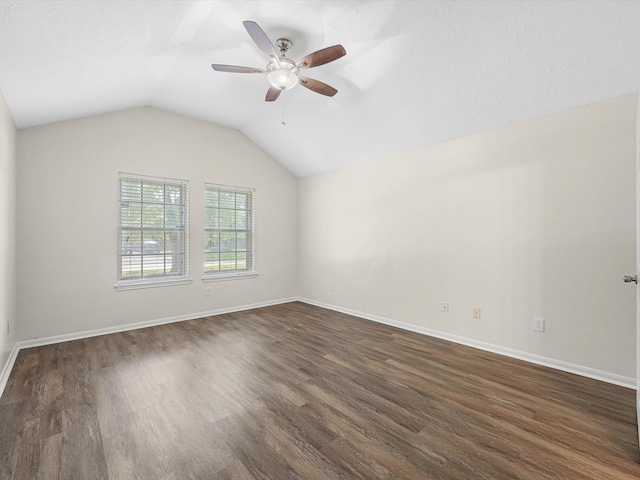 27097 Crown Chase Dr, Kingwood, TX 77339 - additional living space with a ceiling fan, dark wood-type flooring, vaulted ceiling, and baseboards