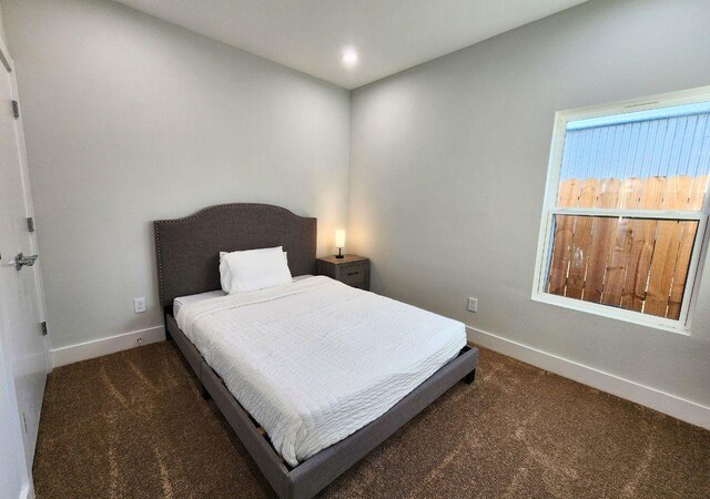 615 Northew St Unit J, Houston, TX 77091 - bedroom with carpet flooring, baseboards, and recessed lighting
