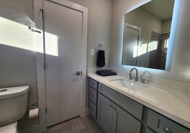 615 Northew St Unit J, Houston, TX 77091 - bathroom with vanity, toilet, a shower, and wood finished floors