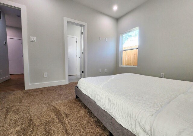 615 Northew St Unit J, Houston, TX 77091 - bedroom with carpet flooring, baseboards, a spacious closet, and recessed lighting