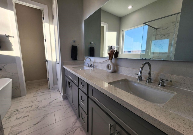 615 Northew St Unit J, Houston, TX 77091 - full bathroom featuring marble look tiles, double vanity, a freestanding bath, a stall shower, and recessed lighting