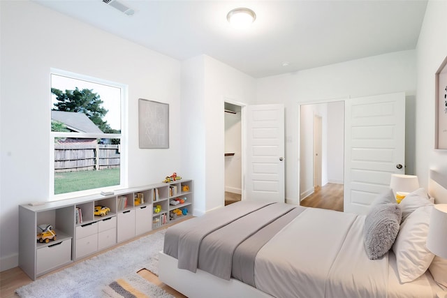601 S Carroll St, La Porte, TX 77571 - bedroom featuring light wood-type flooring