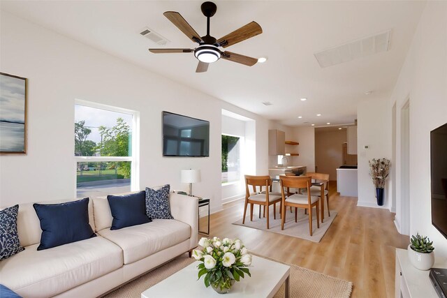 601 S Carroll St, La Porte, TX 77571 - living room with light wood-style floors, a ceiling fan, and recessed lighting