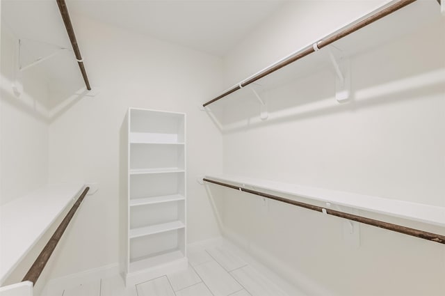 10618 Bassoon Dr, Houston, TX 77025 - spacious closet with light tile patterned floors