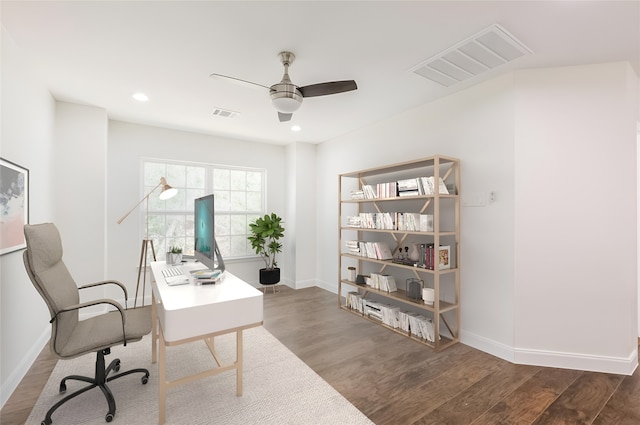 10618 Bassoon Dr, Houston, TX 77025 - home office featuring a ceiling fan, wood finished floors, baseboards, and recessed lighting