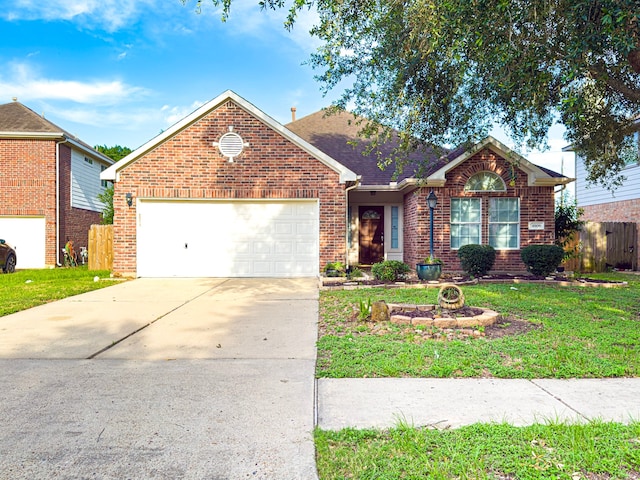 4906 Arbor Falls Ln, Houston, TX 77084 - view of front of property featuring an attached garage, brick siding, concrete driveway, and a shingled roof