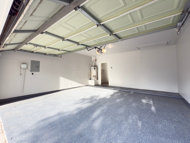 4906 Arbor Falls Ln, Houston, TX 77084 - garage featuring gas water heater, a garage door opener, and electric panel