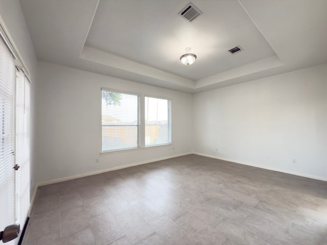 4906 Arbor Falls Ln, Houston, TX 77084 - spare room with a tray ceiling and baseboards