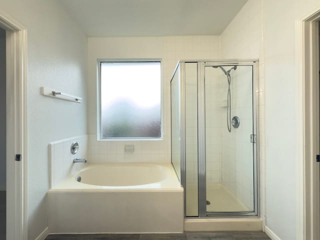 4906 Arbor Falls Ln, Houston, TX 77084 - full bath with a stall shower, a garden tub, and wood finished floors