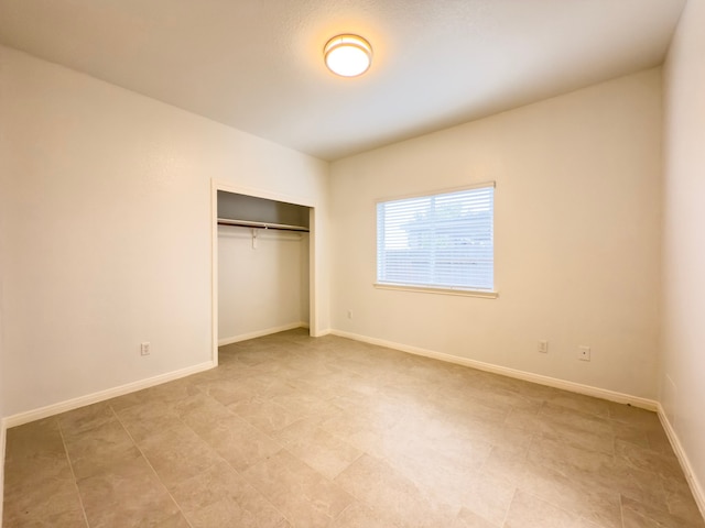 4906 Arbor Falls Ln, Houston, TX 77084 - unfurnished bedroom featuring a closet and baseboards