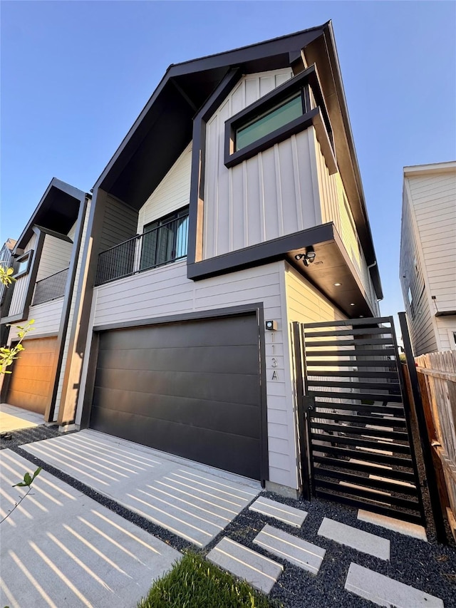 113 E 32nd St Unit A, Houston, TX 77018 - modern home with board and batten siding and a garage
