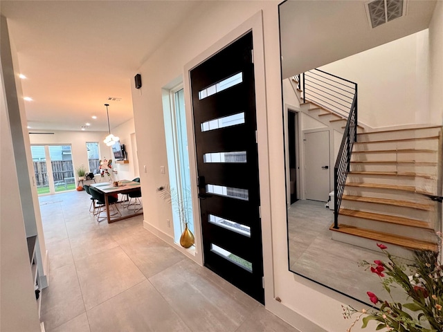 113 E 32nd St Unit A, Houston, TX 77018 - entrance foyer with stairway, light tile patterned flooring, and recessed lighting